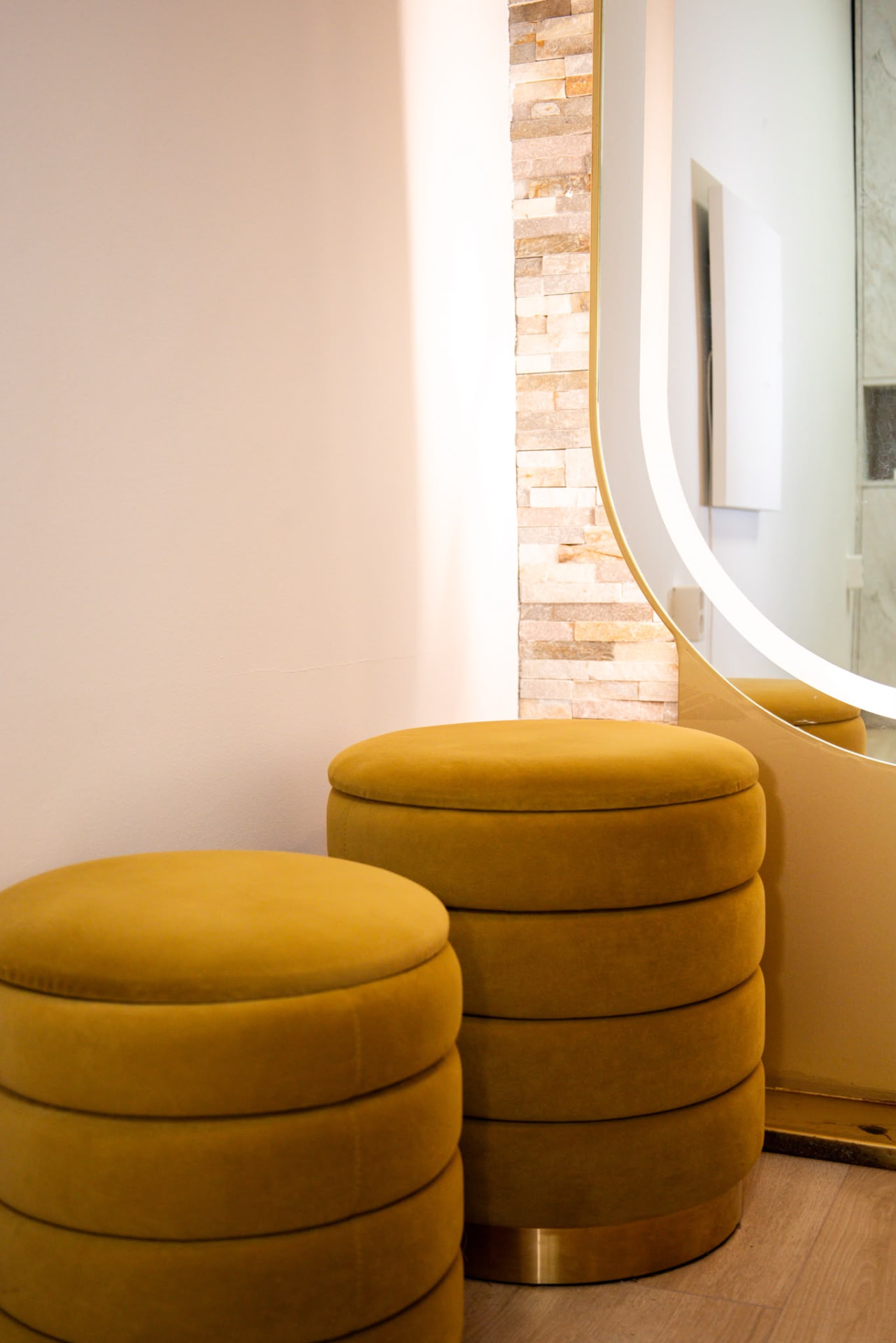 Mustard velvet stools and backlit mirror